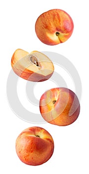 Falling fresh peaches isolated on white background