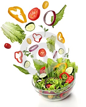 Falling fresh vegetables. Healthy salad