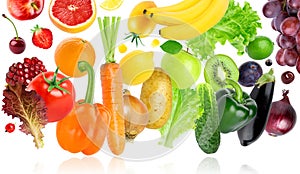 Falling of fruits and vegetables on white background