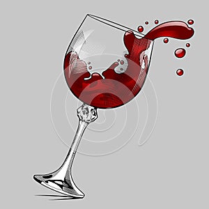 Falling glass with splashed red wine photo
