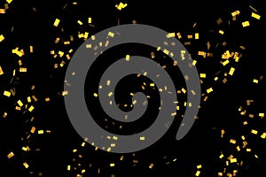 Falling golden metallic glitter foil confetti, animation movement on black background, gold holiday and festive fun