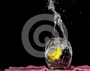 Falling Lime Into Clear Water. Splashing Water Outside, Dark Background