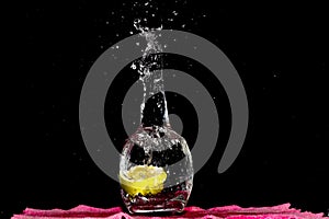 Falling Lime Into Clear Water. Splashing Water Outside, Dark Background