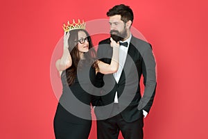 Falling in love with boss. Couple in love red background. Beauty queen and bearded man. Egoistic love. Prom party. Date