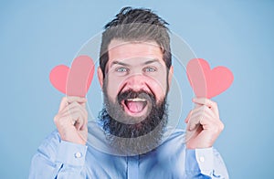 Falling in love. Man bearded hipster with heart valentine card. Celebrate love. Guy attractive with beard and mustache