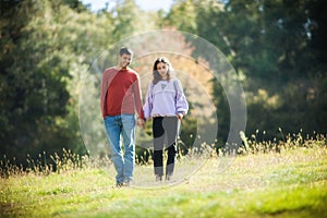 Falling in love. Romantic couple enjoying in meadow walk together in nature outdoor