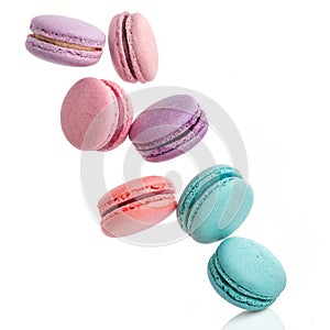 Falling macarons isolated on white