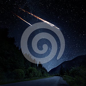 Falling meteorite, asteroid, comet on Earth. Elements of this image furnished by NASA. photo