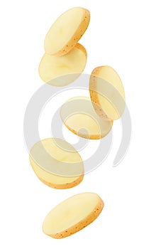 Falling peeled slices of raw washed potato isolated on white