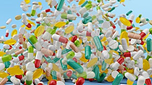 Falling pills, capsules on a blue background. Heap colorful pills. The rotating tablets form a hill. Pharmaceutical