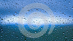 Beautiful lighting and rain drops on the mirror .