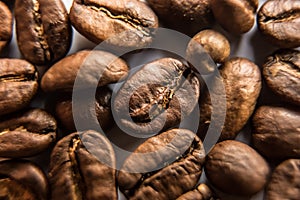 Falling Roasted Coffee Beans, Macro Shot, close-up.