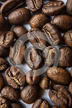 Falling Roasted Coffee Beans, Macro Shot, close-up.