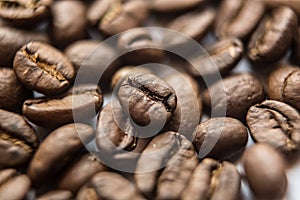 Falling Roasted Coffee Beans, Macro Shot, close-up.