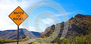 Falling rock sign next to the road