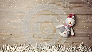 Falling snow with Christmas snowman decoration