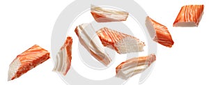 Falling snow crab sticks pieces isolated on white background