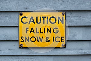 Falling snow and ice yellow sign