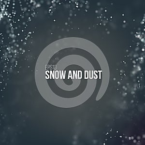 Falling snow particles flying on the air. Dust on the dark background.