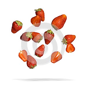 Falling strawberries isolated on white background