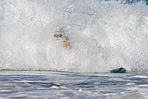 A falling surfer in Hikkaduwa in Sri Lanka. photo