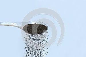 Falling tea powder from spoon