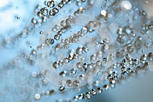 Falling water drops on blue background macro wet rain