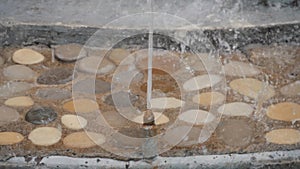 Falling water from a fountain, slow-motion shooting