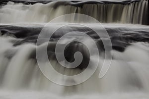 Falling water waterfall close up.