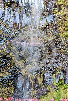 Falling waterfall above Lagoa do Vento lake in Madeira photo