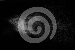 The falling white snow on a black background