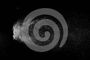 The falling white snow on a black background