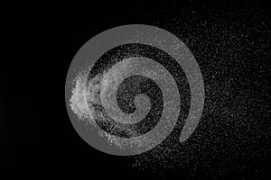 The falling white snow on a black background