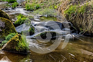 Falls on the small mountain river in a wood