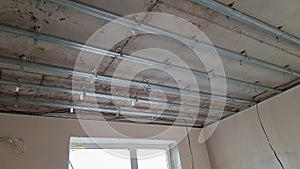 False ceiling design, before installing drywall. Plasterboard ceiling of a house at a construction site, installation of a false
