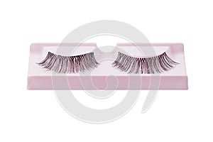 False eyelashes pair on pink display isolated on white