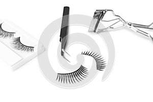 False eyelashes, tweezers and curler