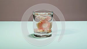 False teeth in a glass of water