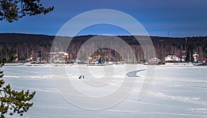 Falun - March 30, 2018: Panorama of the frozen lake at the resort of Framby Udde near the town of Falun in Dalarna, Sweden