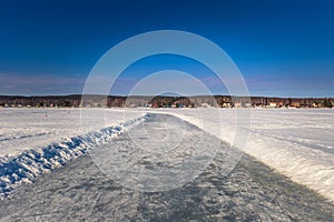 Falun - March 31, 2018: Ice skaing lanes at the frozen lake of Framby Udde near the town of Falun in Dalarna, Sweden