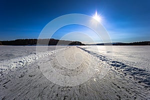 Falun - March 31, 2018: Ice skaing lanes at the frozen lake of Framby Udde near the town of Falun in Dalarna, Sweden