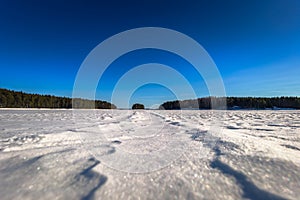 Falun - March 31, 2018: Panorama of the frozen lake of Framby Udde near the town of Falun in Dalarna, Sweden