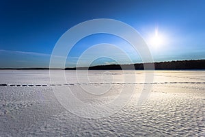 Falun - March 31, 2018: Panorama of the frozen lake of Framby Udde near the town of Falun in Dalarna, Sweden