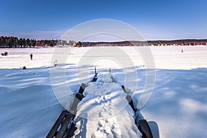 Falun - March 31, 2018: Small frozen pier at Framby Udde near the town of Falun in Dalarna, Sweden