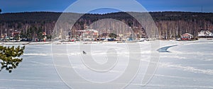 Falun - March 30, 2018: Panorama of the frozen lake at the resort of Framby Udde near the town of Falun in Dalarna, Sweden