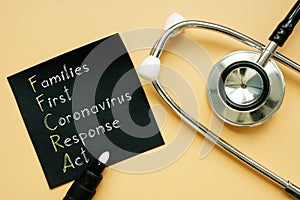 Families First Coronavirus Response Act FFCRA is shown on the photo using the text photo