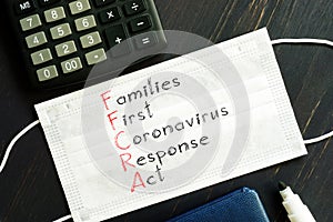 Families First Coronavirus Response Act FFCRA is shown on the photo using the text photo