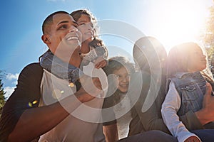 Families grow with love. a happy family spending time together outdoors.