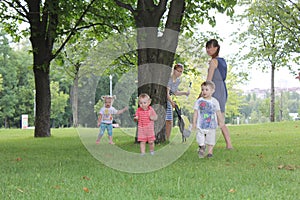 Families, mothers and babies in urban green nature park