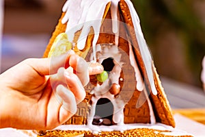 Familiy building a sweet ginger bread house